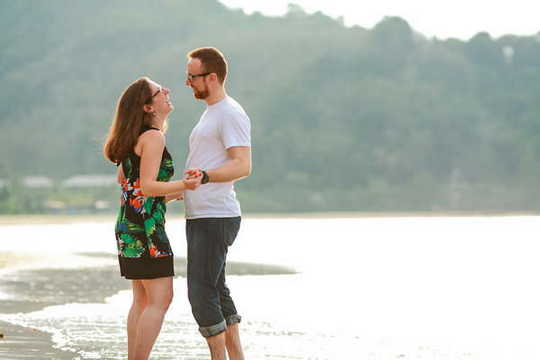 lovely honeymoon couple with stunning background by Koh Yao photographer